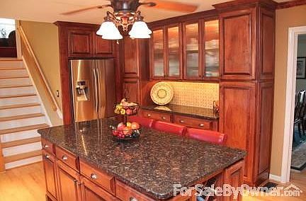 New Gourmet Custom Kitchen
						:
						Granite slab
Custom solid maple cabinets 
Recessed lighting
Wine rack