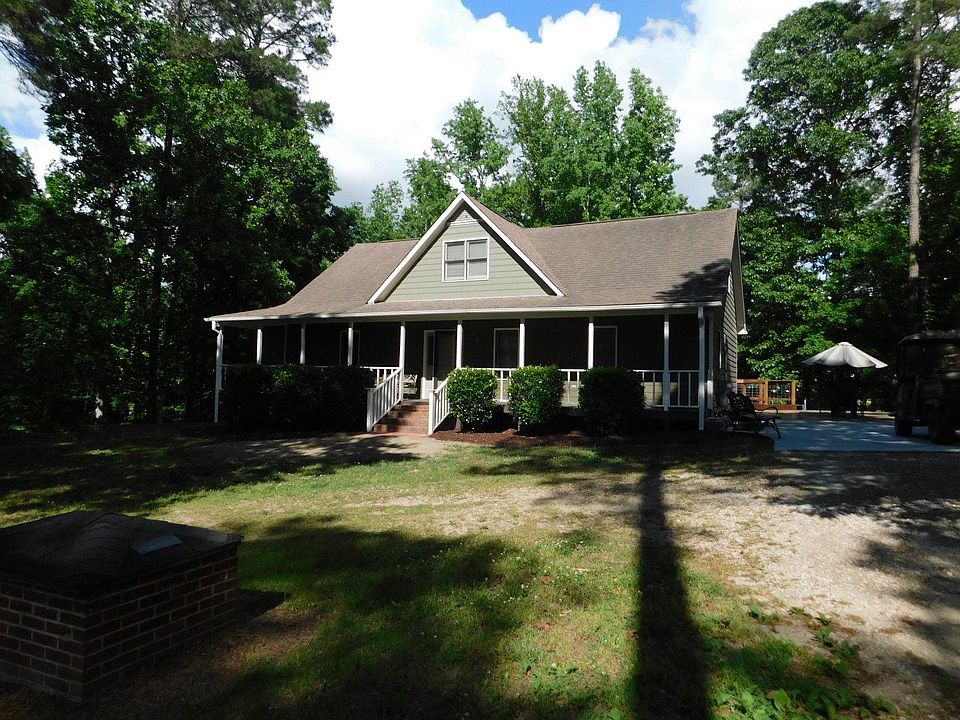 Full Front Porch, circular driveway.