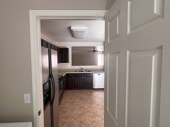 Laundry room looking into kitchen
