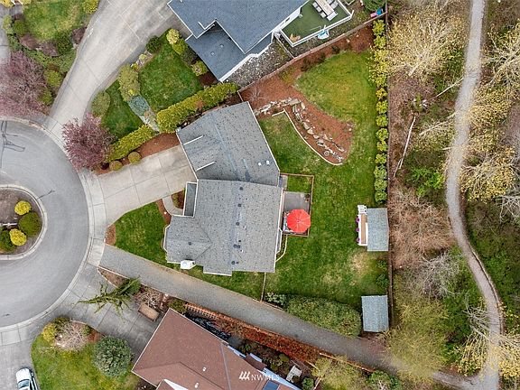 Big private backyard that is fully fenced. Notice the trail behind the fence with trail access directly next door!