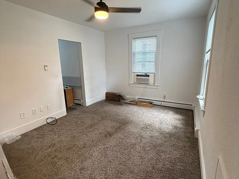 Other view of main room, View into the kitchen on the left