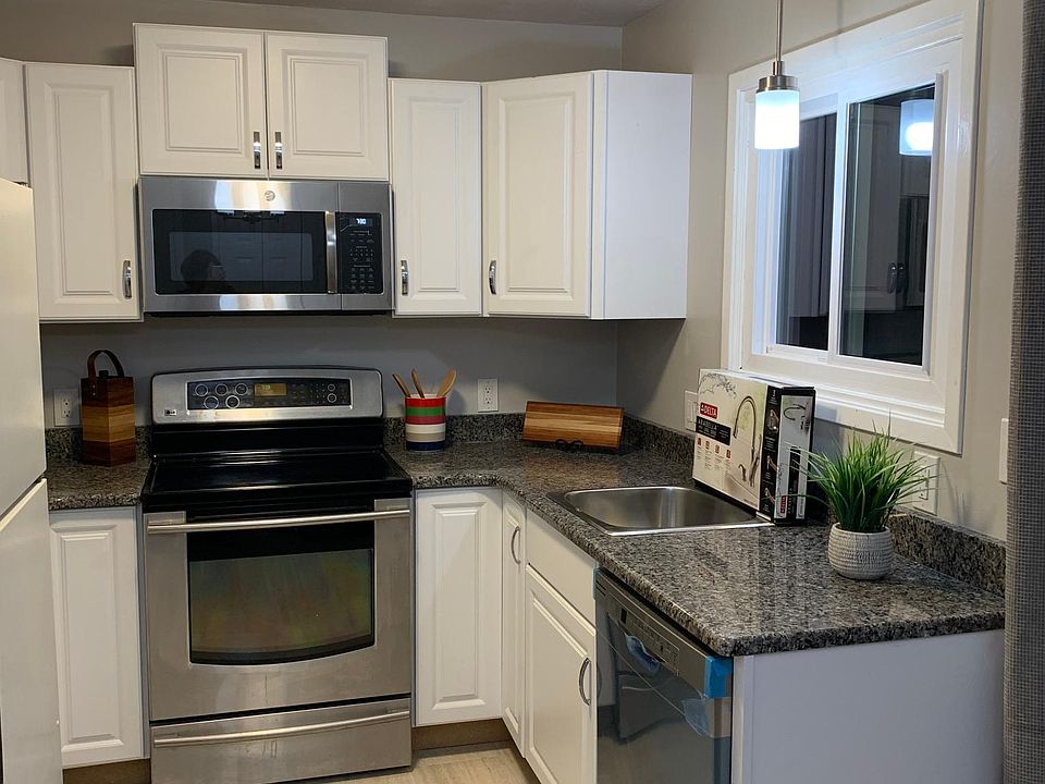 Kitchen features all new granite countertops, cabinets, microwave, dishwasher, and lighting. Eat-in area has access to the deck and tranquil forest views. South facing kitchen and eat-in area get lots of natural light and enjoy warm, light-filled days dur
