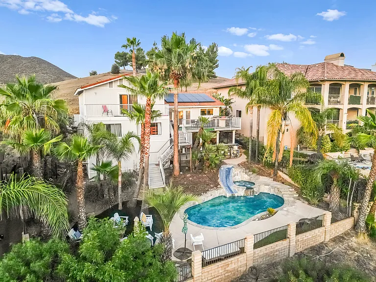 Drone view of the slide, pool and hot tub.