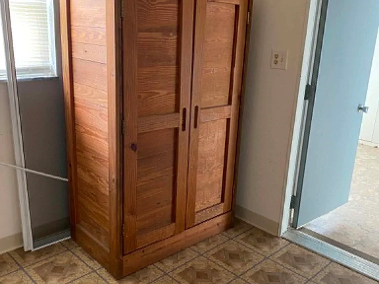 Utility room with storage cabinet