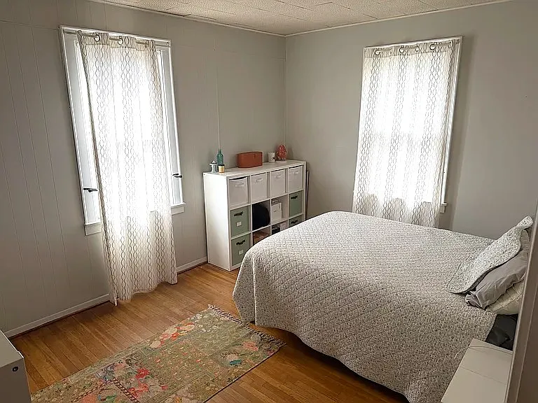 Bedroom 1 with two windows and closet