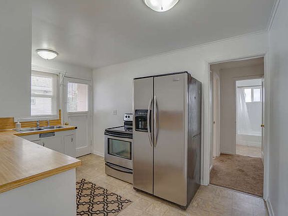 Large kitchen with stainless steel applicances and lots of storage.