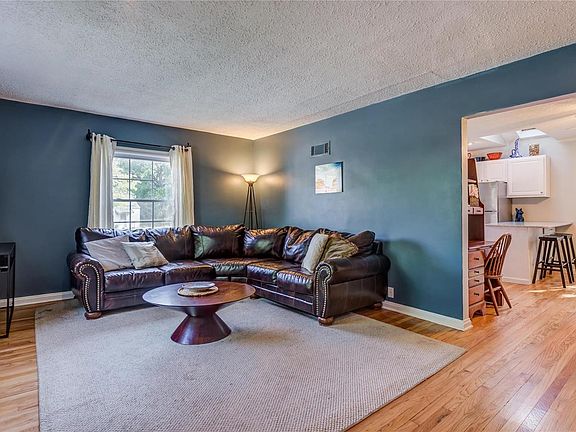 Spacious living room that opens to dining room and kitchen