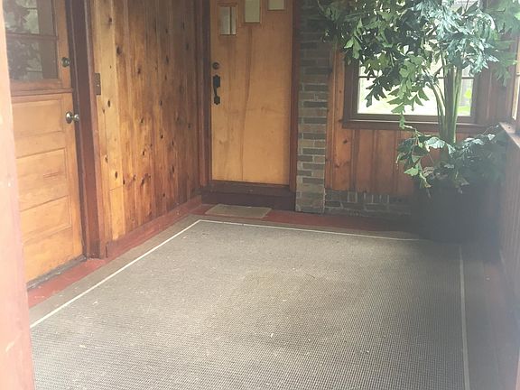 Entryway is a fully enclosed sunroom / mud room. Main front door is extra wide for bringing in larger furniture.