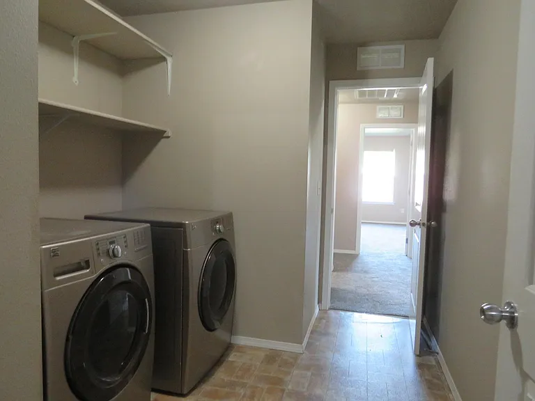 Laundry room with front loader washer and dryer