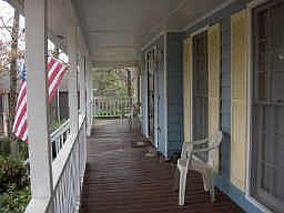 What a wonderful front porch with swing!