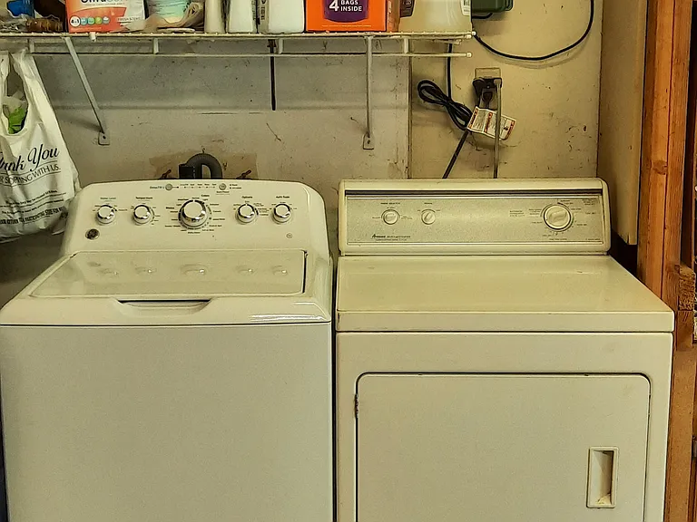 Shared washer and dryer in garage.