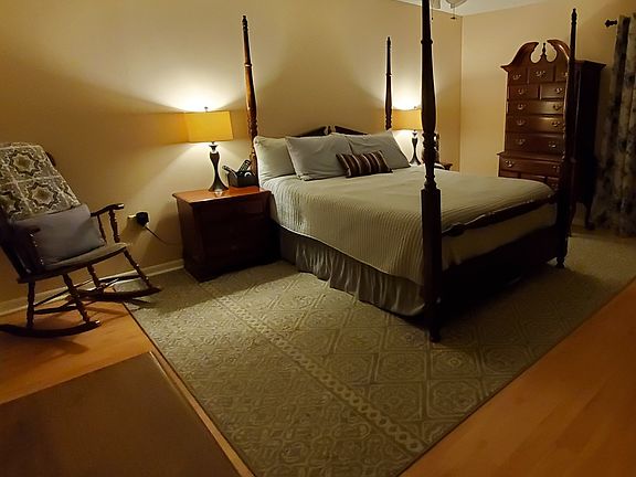Master bedroom with LVP wood floors and walk-in closet