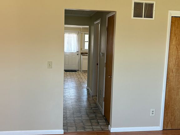 Hallway passing Bedroom & Bathroom into Kitchen.