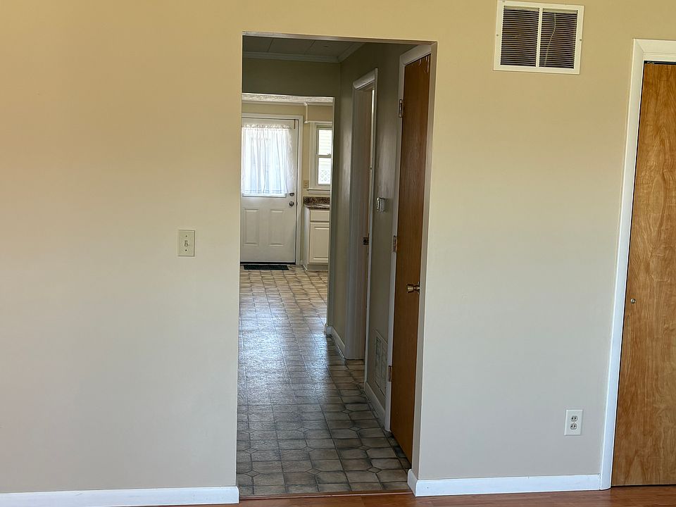 Hallway passing Bedroom & Bathroom into Kitchen.
