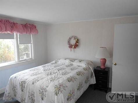 Can you "picture" what A GREAT view you could have, if you remodled this room with a corner window unit?