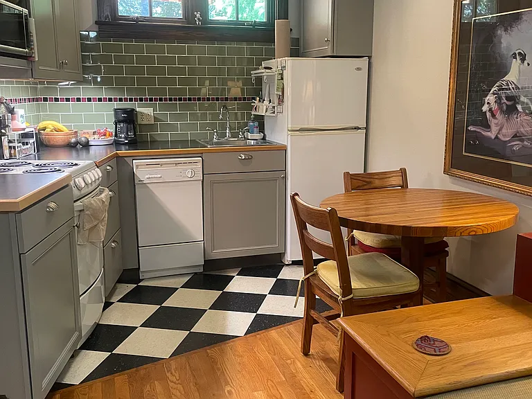 Fully provisioned kitchen with pots, pans, dishes and small appliances. Dishwasher, microwave and toaster oven.