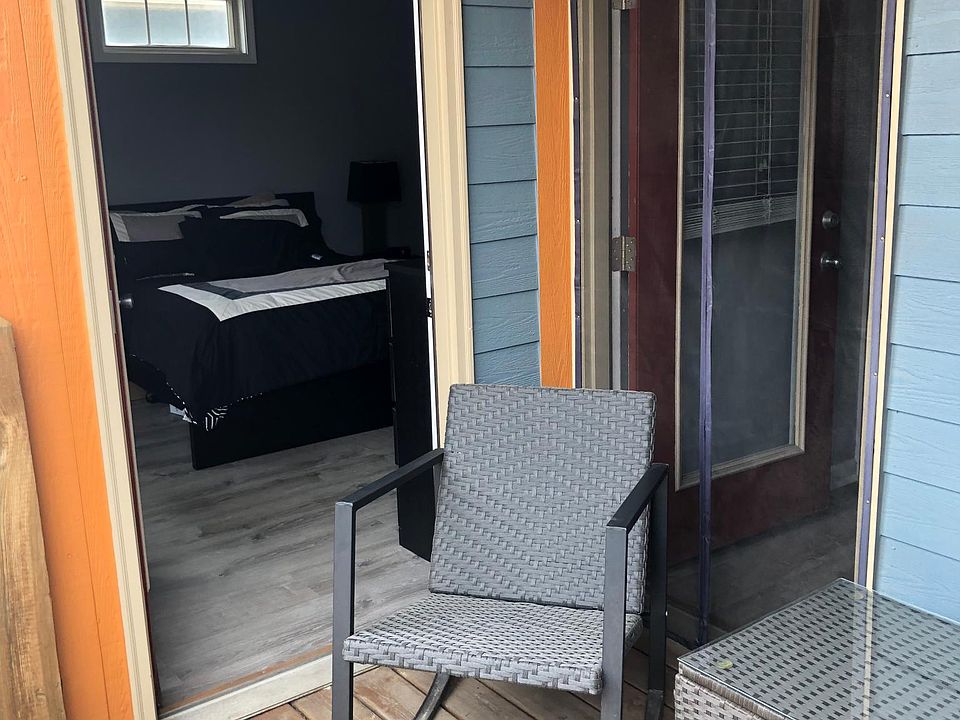 Covered patio connects directly off the master bedroom and has additional condo access with included screen door.