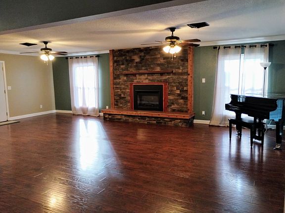 JUST LOOK AT THIS FIREPLACE. SUCH A OPEN AND WARMING ROOM.