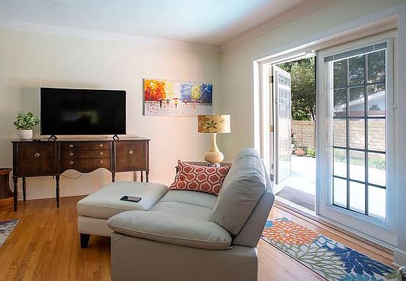 Living area opens out to large pool