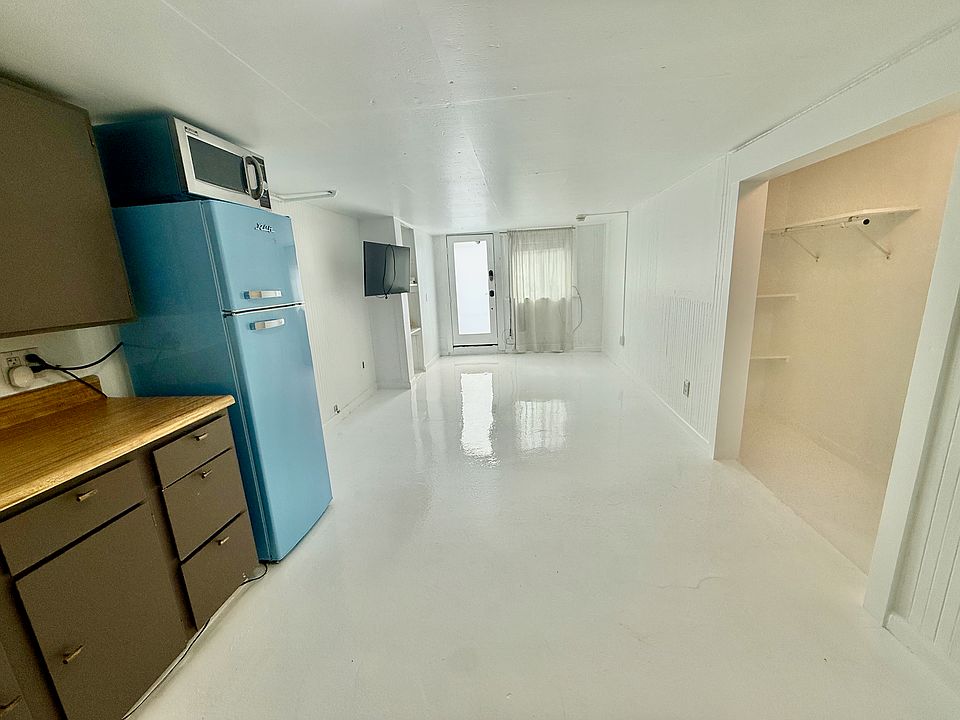 Livingroom from kitchen, with full walk-in closet on right