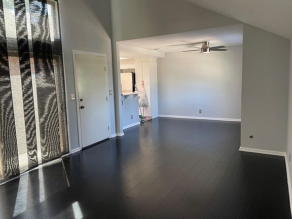 living room and dinning room with double glass window to the patio