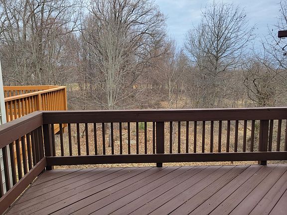 Large deck with beautiful wooded view