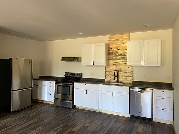 Stainless steel appliances and butcher block counters (new pictures coming soon). Not shown is pantry on backside of stairs leading up to loft.
