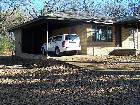Porch, carport, large yard.