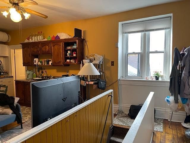 Enter 3rd Floor Loft Naturally Bright Apartment, with Dishwasher hidden by Large TV