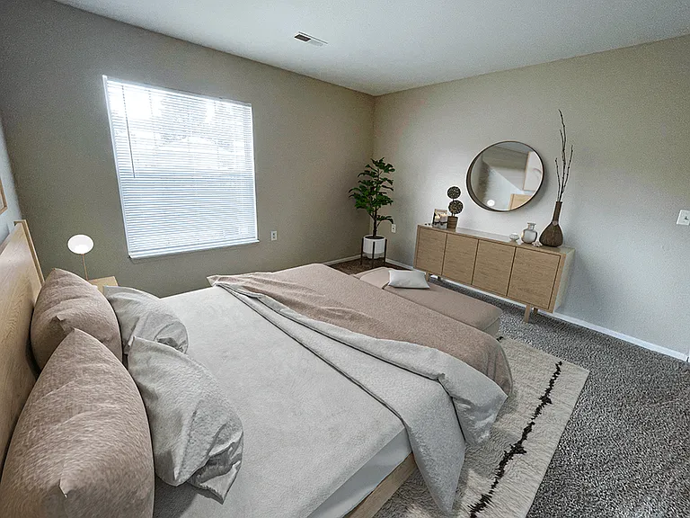 Spacious Carpeted Bedroom with Window