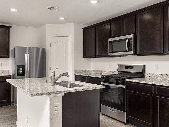 You will love the large granite island and brand-new appliances.