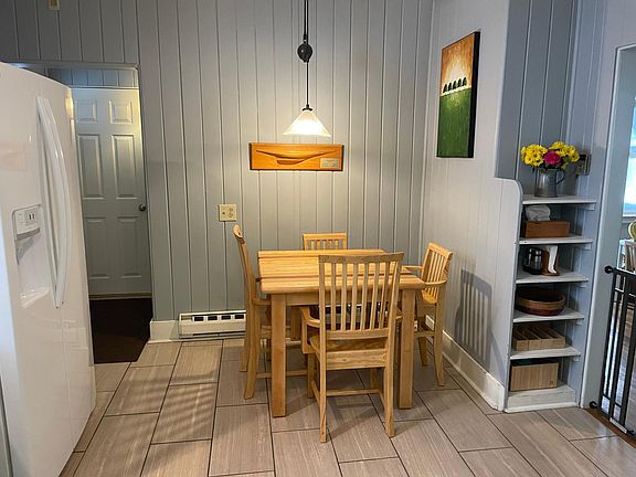 breakfast nook in kitchen, looking to entrance into private backyard, walks onto deck
