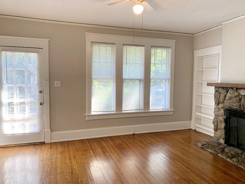Living room with large windows and hardwood floors!