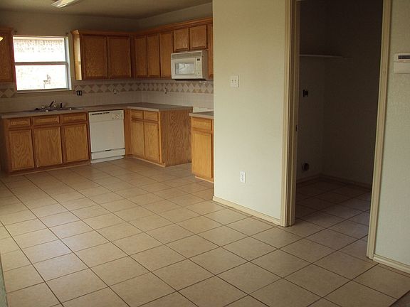 separate laundry room/pantry area that has pre- washer n dryer hookup .. 
