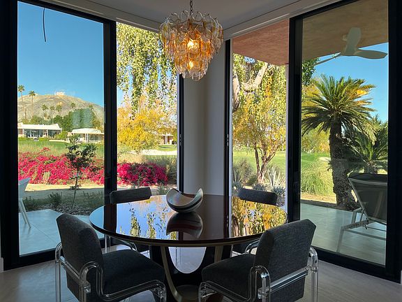 Dining area, can seat 8, overlooking two fairways, green and mountains!