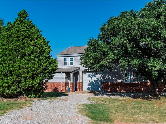 Shop behind house is approximately 72 feet by 54 feet, 18 foot eves & two stories with 3 garage doors.