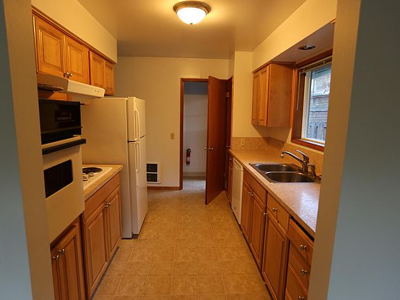 Galley kitchen, lots of storage and work space. Window faces west.