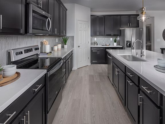 Residence 3 kitchen modeled at a nearby Meritage community.