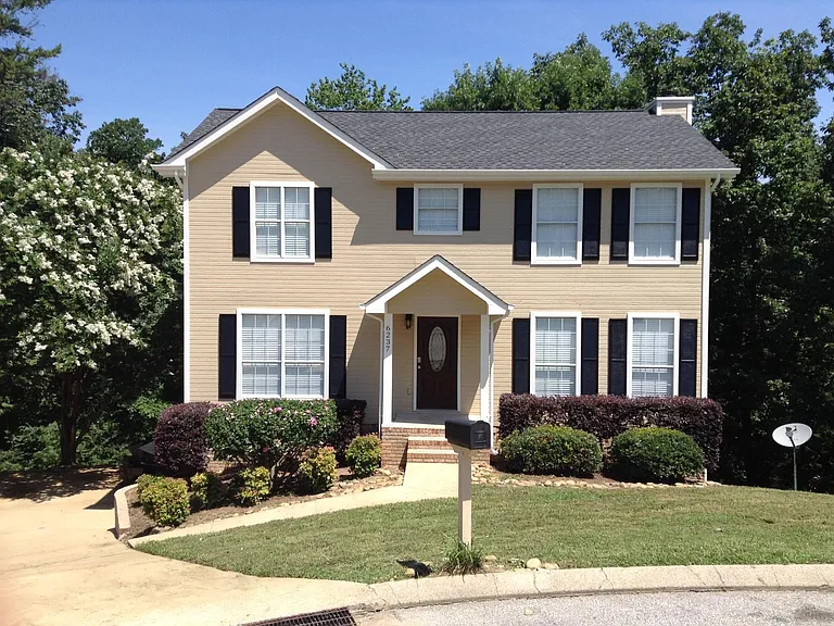 Beautiful 3/2.5/2 with man cave or game room down.
