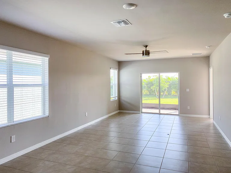 View of living room with fans installed.