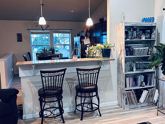 This picture is taken from the living room looking over to the kitchen. The bar stools are nice.