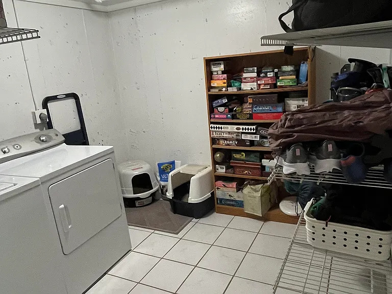 Basement room with built in wall storage