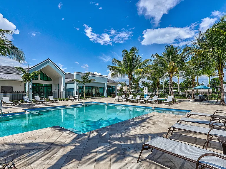 Imperial Crossing Luxury Apartment Homes resort style pool and lounge chairs.