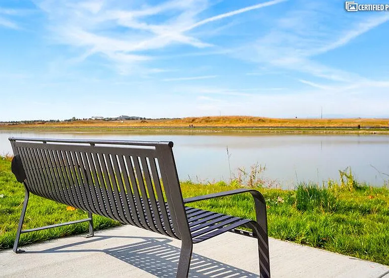 Peaceful pond with walking trail just steps from building