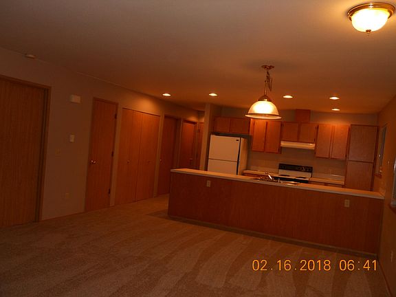 Kitchen/laundry closet/hall to 2 bedrooms and main bath