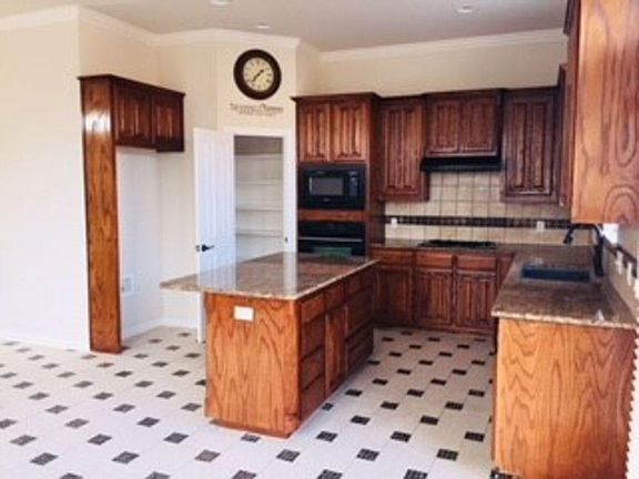 Open concept kitchen with built ins.