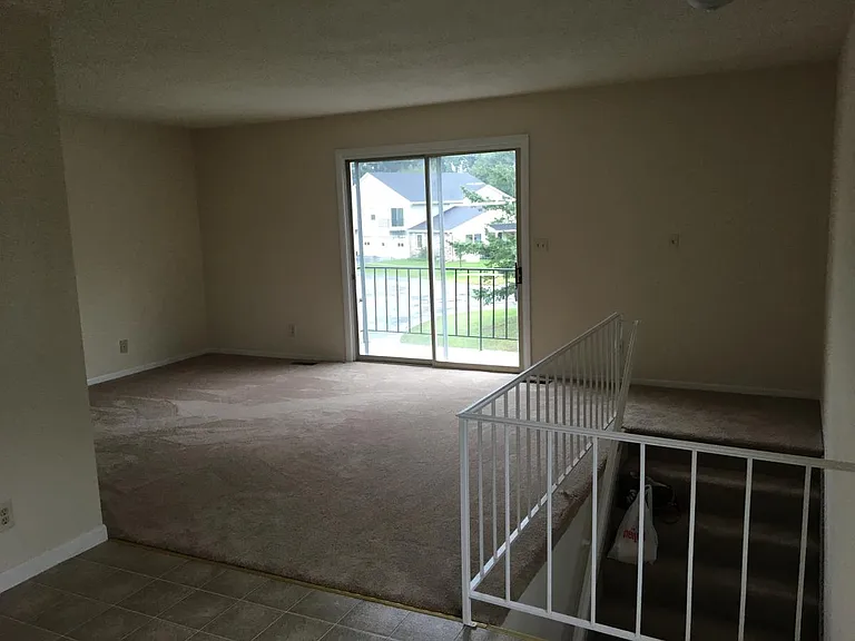 Living room w/ balcony
