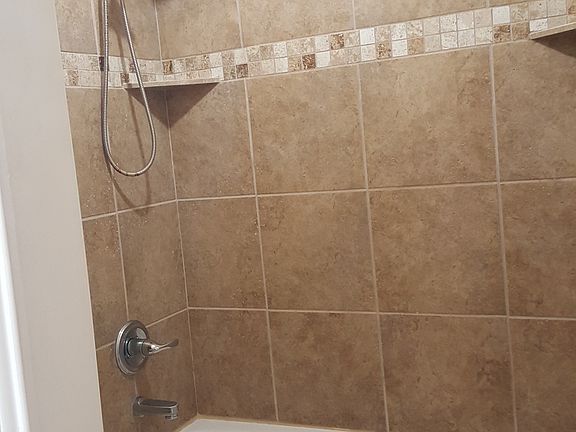 Tiled shower area w/ loads of hot water available
