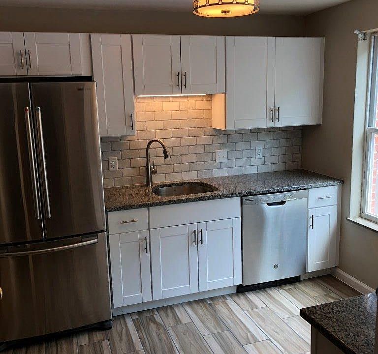 White Kitchen with Stainless Steel Accents