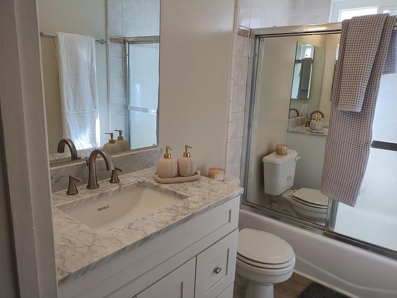 remodeled bathroom with quartz countertops
